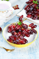 Fresh Red Finger Grapes with Mint in Golden Bowl - Healthy Fruit Snack Display