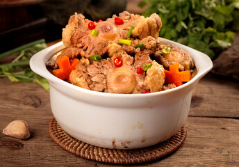 Spicy Stewed Oxtail with Vegetables in White Bowl - Traditional Braised Beef Tail Dish