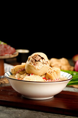 Traditional Mongolian Steamed Meat Buns (Buuz) with Sheep Filling in Bowl - Authentic Asian Cuisine