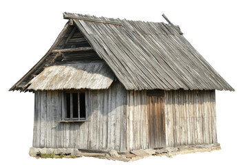 Naklejka premium Old wooden hut with a thatched roof stands in isolation showcasing rustic architecture and traditional building techniques under natural light