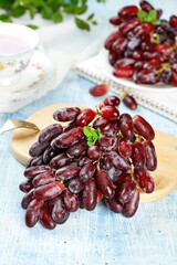 Fresh Red Finger Grapes from Yunnan China on Wooden Cutting Board