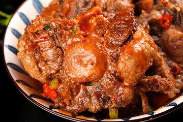 Braised Oxtail Stew with Bone Marrow and Vegetables in Ceramic Dish