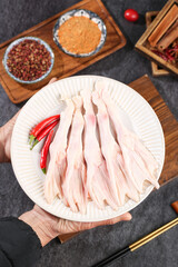 Raw Duck Feet with Chili Peppers and Spices on Wooden Cutting Board - Premium Asian Cooking Ingredients