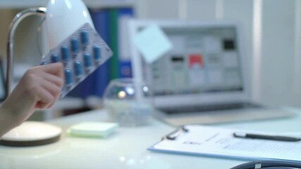 A sleek workspace showcases the intersection of medicine and technology. A laptop displays data while documents and a pen rest on a clean desk, highlighting innovative solutions in healthcare.
