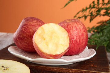 Fresh Red Striped Apples Cut in Half on Plate - Healthy Fruit Food Photography