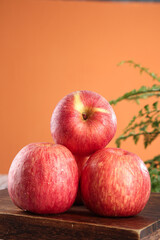 Fresh Red Apples on Wood with Orange Background - Luochuan Fruit Display