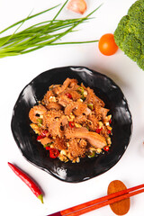 Spicy Yellow Tripe Stir-Fry with Fresh Vegetables Traditional Asian Dish in Black Bowl