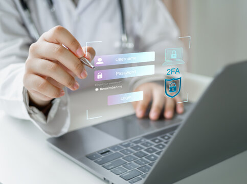 Medicine doctor using laptop for two-factor authentication (2FA) with data protection icons. Concept of secure login, cybersecurity, password security, identity verification, and online privacy