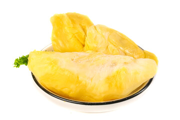 Fresh Golden Durian Fruit Pulp Segments on Black Plate with Parsley Garnish