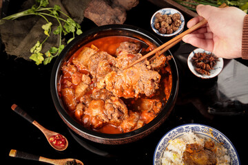 Spicy Beef Oxtail Bone Stew with Chopsticks - Traditional Asian Hot Pot Dish