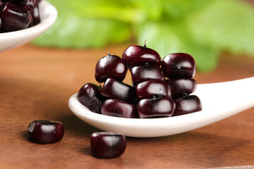 Xishuangbanna Purple Glutinous Beans from Yunnan China in White Bowl on Wood Table