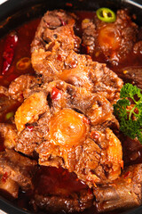 Braised Oxtail Stew with Carrots and Fresh Herbs in Rich Brown Sauce