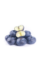 Fresh Blueberries with Cut Halves Showing Interior on White Background