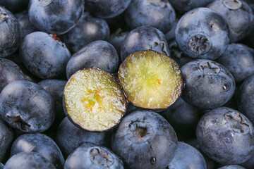 Fresh Blueberry Duo Cut in Half Showing Juicy Interior - Healthy Berry Fruit Background