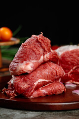 Fresh Raw Beef Steaks on Wooden Cutting Board Ready for Cooking