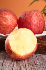 Fresh Red Striped Fuji Apples from Luochuan Shandong China on Rustic Wooden Table