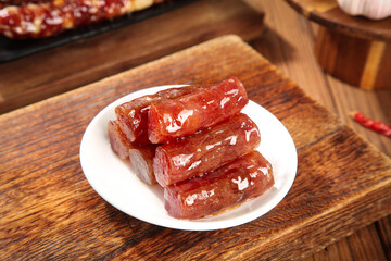 Chinese Air-Dried Sweet Sausages Canton Style Specialties on Wooden Table