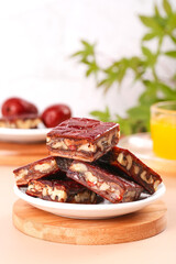 Homemade Date Nut Bars with Glaze - Healthy Convenient Snacks on Wooden Board