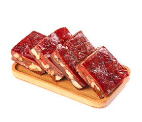 Delicious Date Walnut Pie Slices with Red Glaze - Vegetarian Dessert on Wooden Board