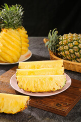 Fresh Pineapple Slices from Zhanjiang Guangdong China on Wooden Board with Tropical Fruits