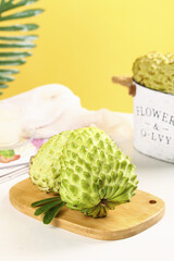 Fresh Custard Apples Sugar Apples on Wooden Board Yellow Background Tropical Fruit Display