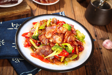 Sizzling Sausage and Broccoli Stir-Fry on Plate with Asian Table Setting