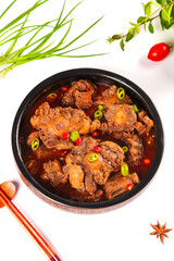 Braised Oxtail Stew with Bone Marrow and Vegetables in Traditional Black Bowl