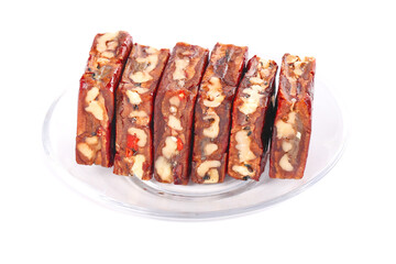 Traditional Xinjiang Date Nut Cake Slices with Cashews and Red Dates on White Background