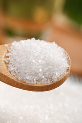 White Sea Salt Crystals on Wooden Spoon - Coarse Cooking Salt with Shallow Focus