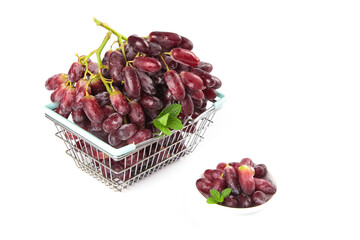 Fresh Red Grapes in Shopping Basket with Mint on White Background