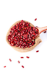 Red Kidney Beans in Burlap Sack with Wooden Spoon on White Background