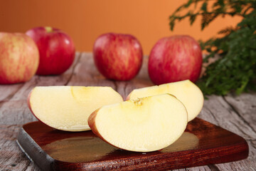 Fresh Red Striped Fuji Apples from Shandong Luochuan - Whole and Sliced on Wooden Board