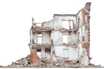 Demolished residential structure showcasing extensive damage and debris in an urban environment during daylight