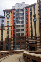 Fototapeta premium facade of a modern apartment building with a clock