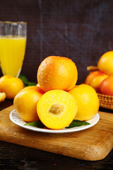 Fresh Golden Nectarines with Orange Juice on Wooden Cutting Board - Healthy Breakfast Concept