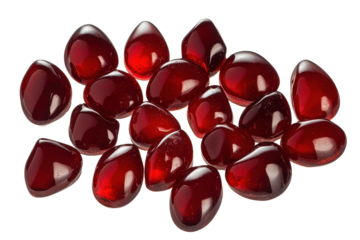 Clusters of vivid red drops arranged on a plain background, showcasing the glossy surface and unique shapes of each piece in perfect clarity