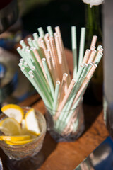 Pastel Striped Paper Straws in Glass at Drink Station