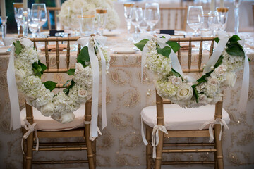 Art Deco Wedding Chairs with Floral Garlands and Ribbons