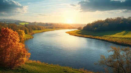 Calm river flowing through autumn landscape with colorful trees and grassy banks under a bright cloudy sky at sunset