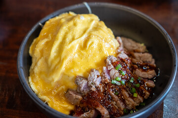 Cheese Omelet served on plate with sliced meat steak, with Thai spicy dipping sauce