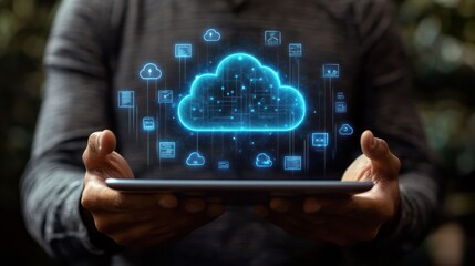 Close-up of hands holding a digital tablet projecting a glowing blue cloud computing network hologram with interconnected data icons