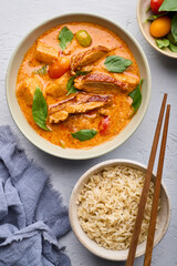 Tender roast duck in a delicious red curry with potatoes and tomatoes, served with brown rice.