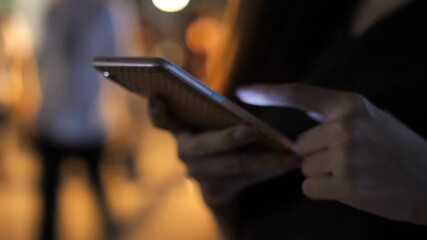 Closeup scrolling phone hand holding phone using mobile smartphone Millennial style on Social media