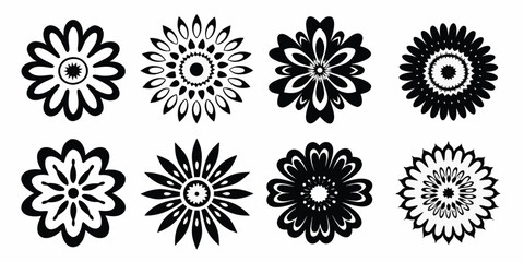 Collection of eight stylized black floral ornaments and decorative elements on a white background