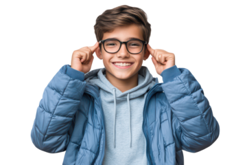 Cheerful teenage boy wearing glasses and a blue jacket smiles broadly, showcasing his joyful personality and youthful spirit in a bright environment