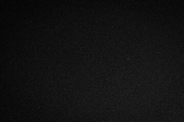 Fototapeta premium Black texture background. Textured surface for design or text. Top view. Free space.