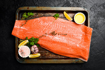 Half of fresh raw salmon fillet ready to cook. Top view.