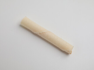 Rolled wafer or biscuits on white background