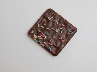 Crunchy crackers coated with chocolate and sprinkles