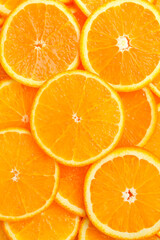 Slices of oranges close-up. Vertical photo. Top view.